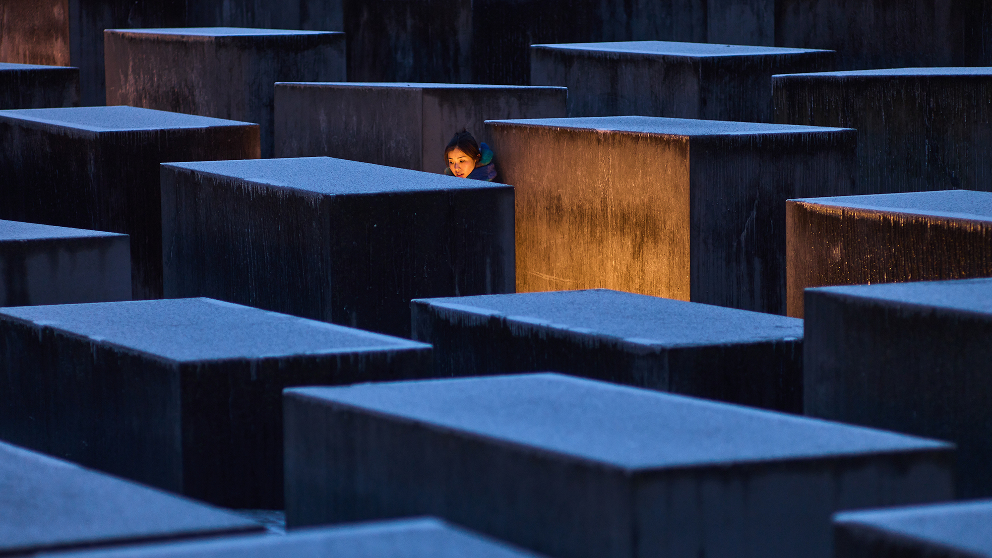 A woman visits the Memorial to the Murdered Jews of Europe on the eve of Holocaust Memorial Day in Berlin, Germany