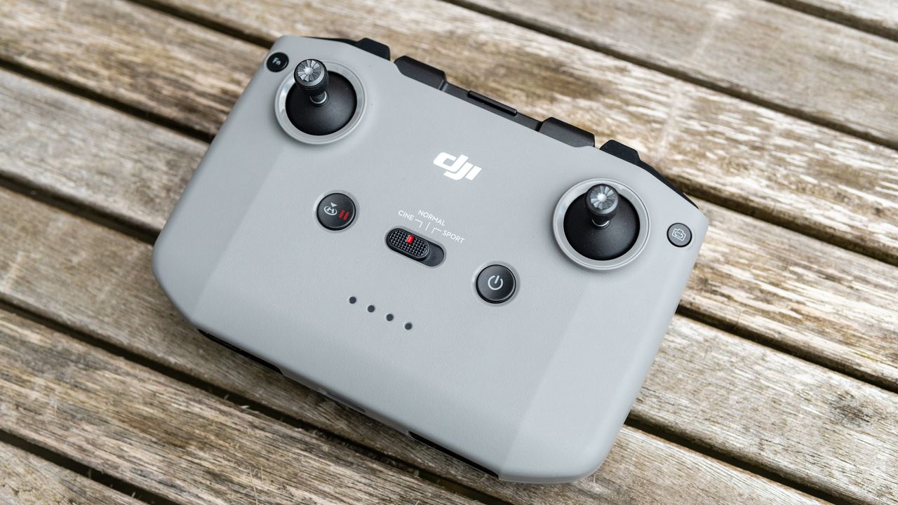 A controller for the DJI Air 2S drone on a wooden table