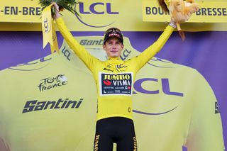 JumboVismas Danish rider Jonas Vingegaard celebrates on the podium with the overall leaders yellow jersey after the 18th stage of the 110th edition of the Tour de France cycling race 184 km between Moutiers and BourgenBresse in the French Alps on July 20 2023 Photo by Thomas SAMSON AFP Photo by THOMAS SAMSONAFP via Getty Images