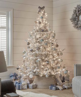 frosted white christmas tree in living room
