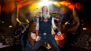 Johan Hegg sticking his tongue out on stage