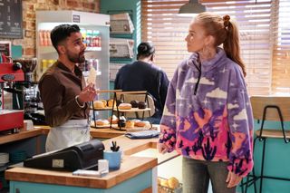Bianca Jackson approaching Vinny Panesar in the cafe