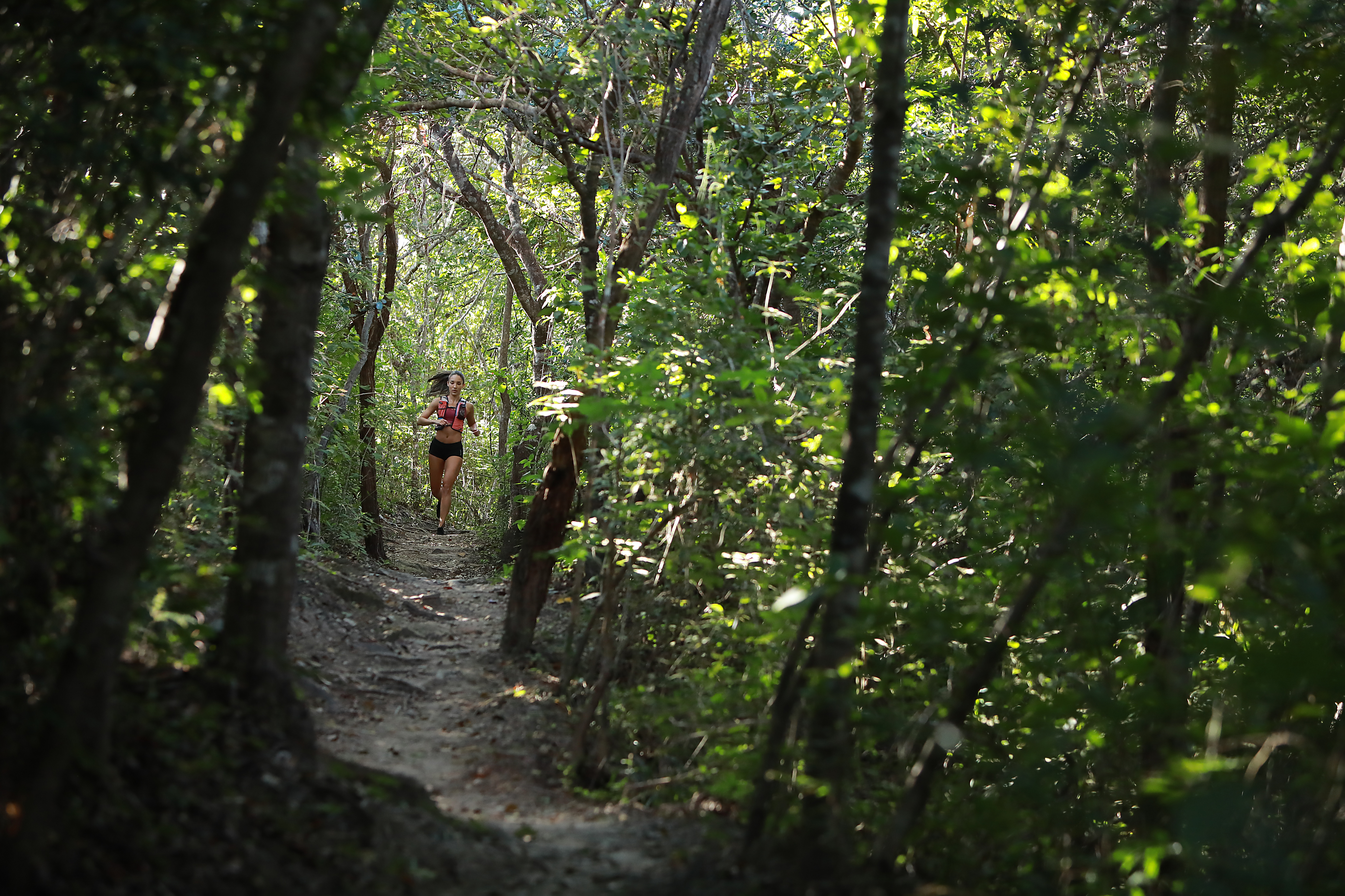 A woman runs through Rio Perdido