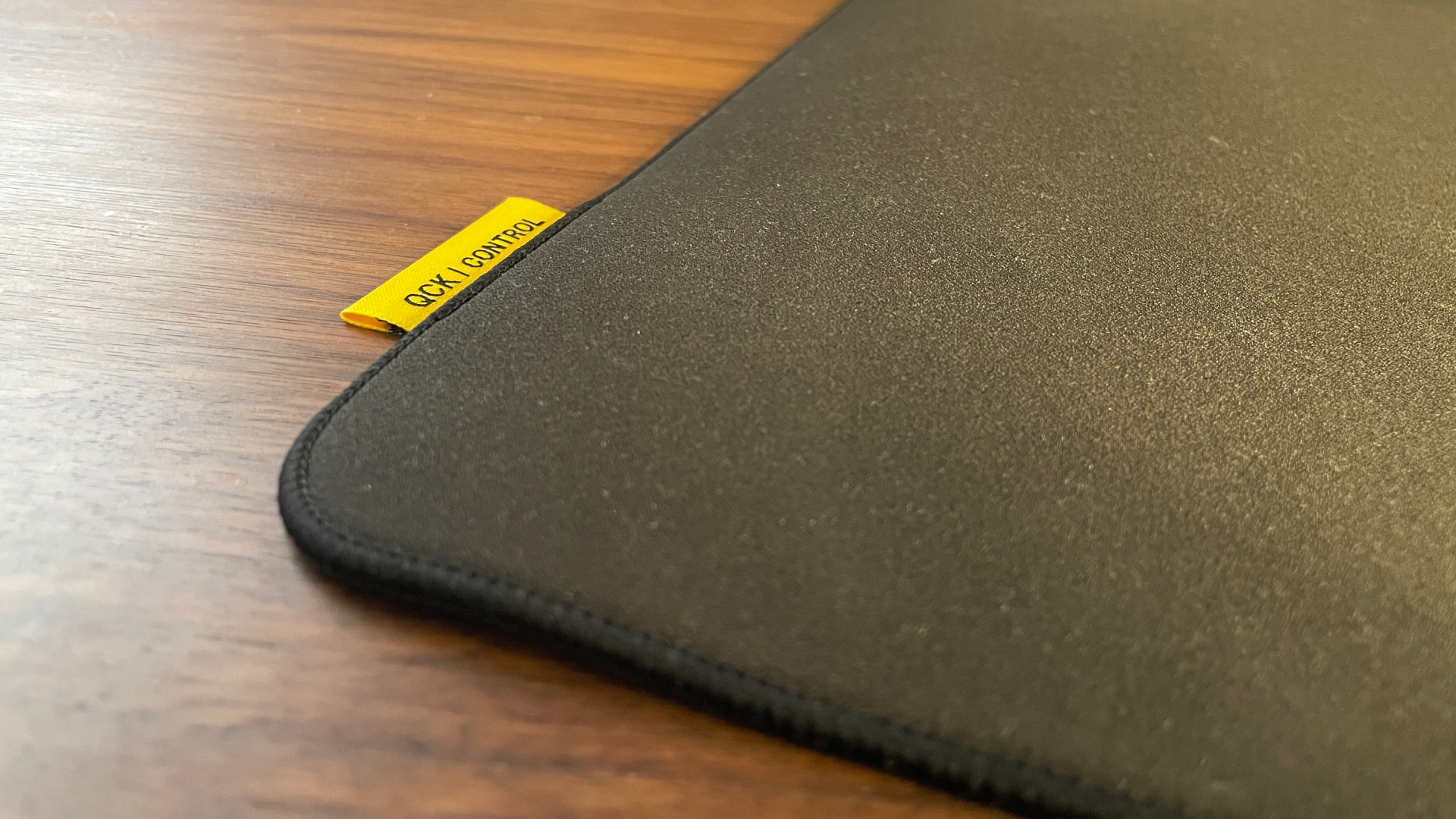 A Steelseries QcK Performance Control mouse pad on a desk.