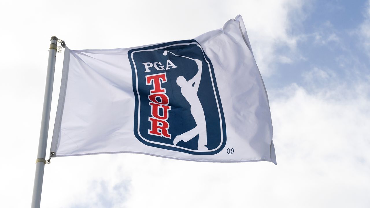 Close up of a PGA Tour flag blowing in the wind