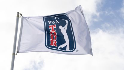 Close up of a PGA Tour flag blowing in the wind
