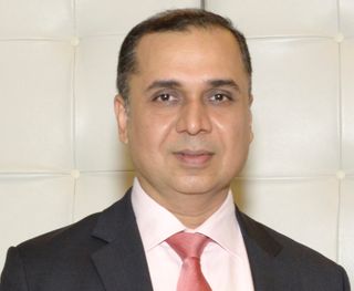 Dharmendra Sawlani, President of DCG and founder of Smile Computers LLC