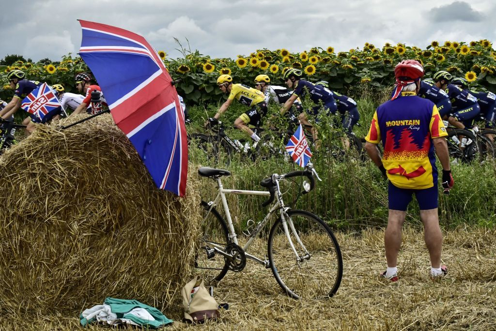 A British fan watches Chris Froome ride by