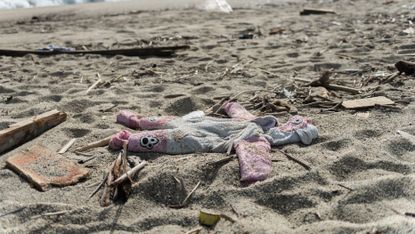 little girls dress on sandy beach