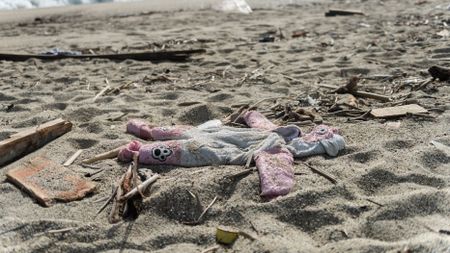 little girls dress on sandy beach