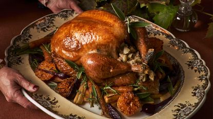Roasted turkey and vegetables on a vintage platter