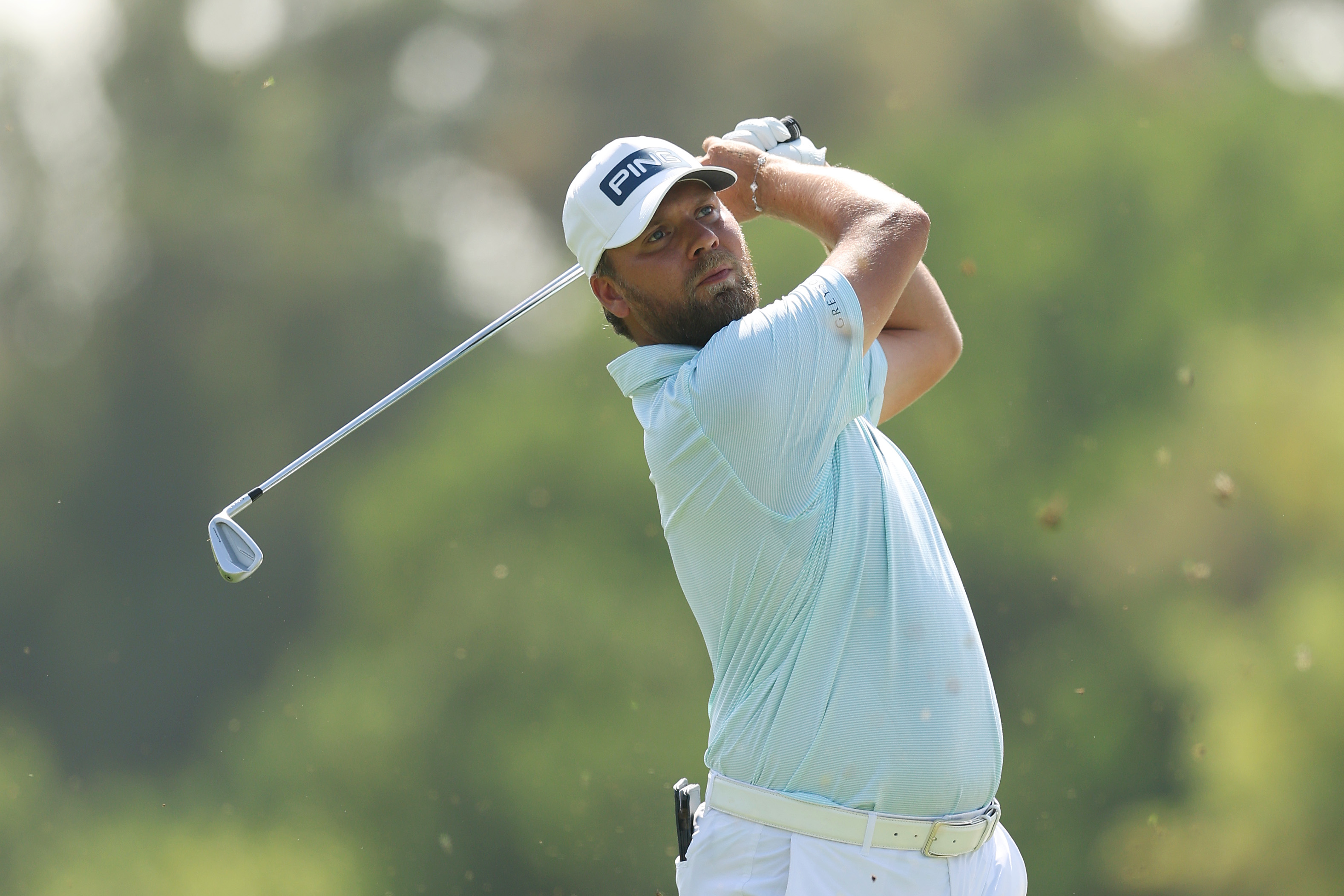 Dan Brown hits an iron shot