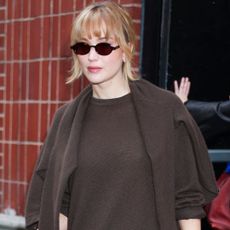 Jennifer Lawrence styled La Ligne jeans and the triangle scarf trend with a Hermès Kelly bag and Nike Air Rift sneakers