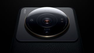 Xiaomi 12S smartphone camera lens on black background