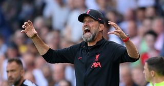 Liverpool manager Jurgen Klopp gives his side instructions during the Premier League match between Fulham FC and Liverpool FC at Craven Cottage on August 06, 2022 in London, England.