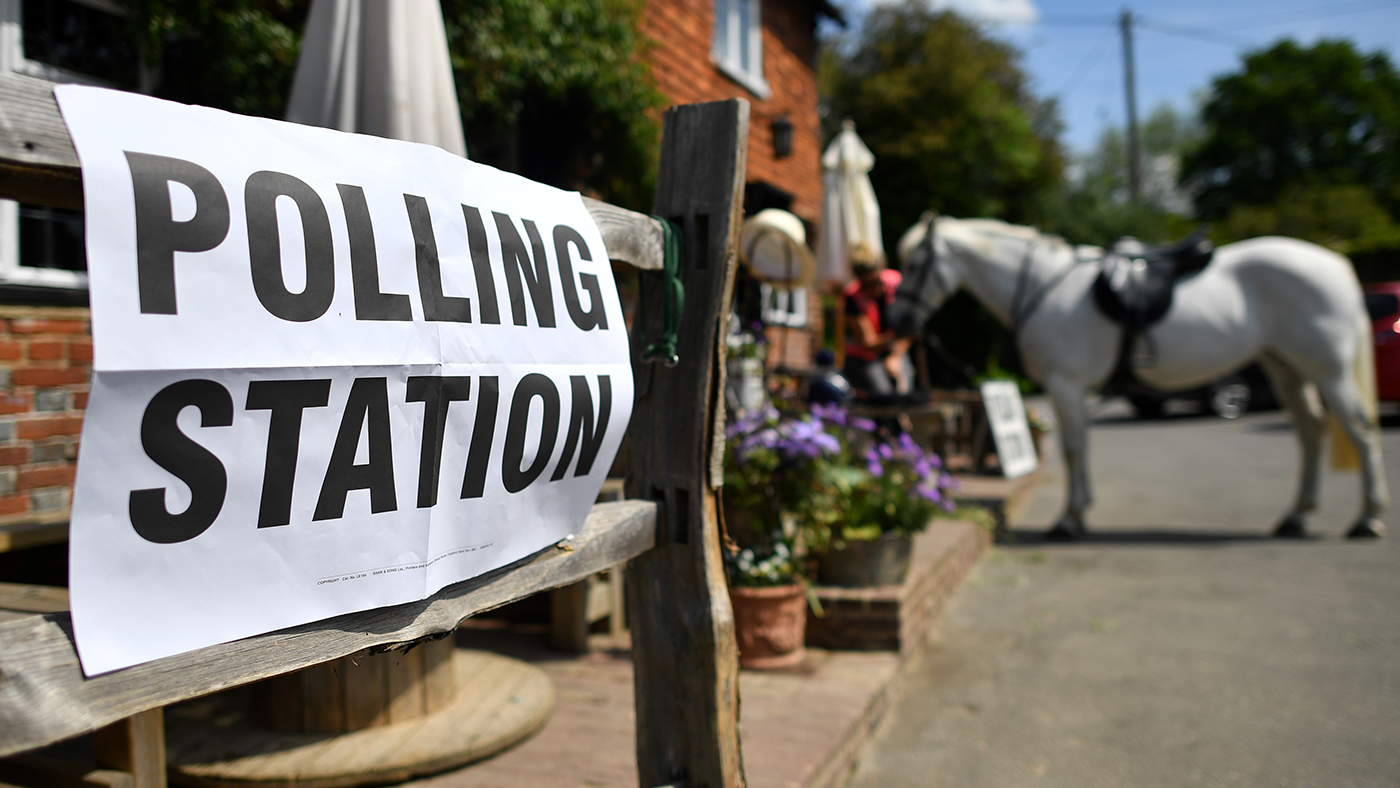 A voter sits with her horse after riding to a polling station, set up in a pub, to vote in the European Parliament elections, near Tonbridge, south east England, on May 23, 2019. - Voting got under way in Britain early on Thursday in elections to the European Parliament -- a contest the country had not expected to hold nearly three years after the Brexit referendum. (Photo by Ben STANSALL / AFP) (Photo credit should read BEN STANSALL/AFP via Getty Images)