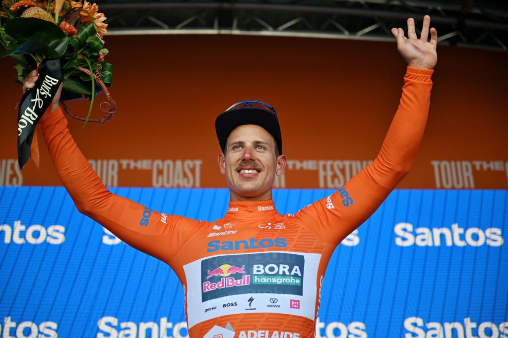 GUMERACHA AUSTRALIA JANUARY 21 Sam Welsford of Australia and Team Red Bull BORA hansgrohe celebrates at podium as Orange Santos Leaders Jersey winner during the 25th Santos Tour Down Under 2025 Stage 1 a 1507km stage from Prospect to Gumeracha 342m UCIWT on January 21 2025 in Gumeracha Australia Photo by Dario BelingheriGetty Images