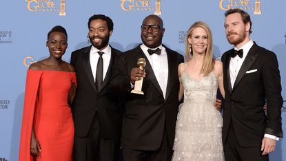 BEVERLY HILLS, CA - JANUARY 12:(L-R) Actors Lupita Nyong'o and Chiwetel Ejiofor, director Steve McQueen, actors Sarah Paulson and Michael Fassbender, winners of Best Motion Picture - Drama fo