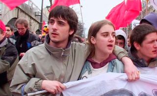 Male and female in a street protest