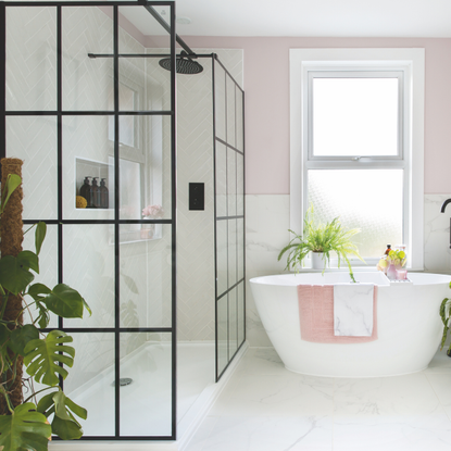 Modern white bathroom with matte black finishes.