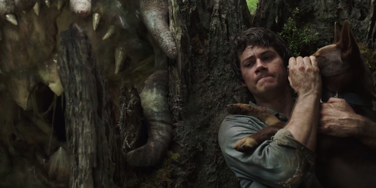 Love and Monsters Dylan O&#039;Brien trying to keep his dog quiet near a monster