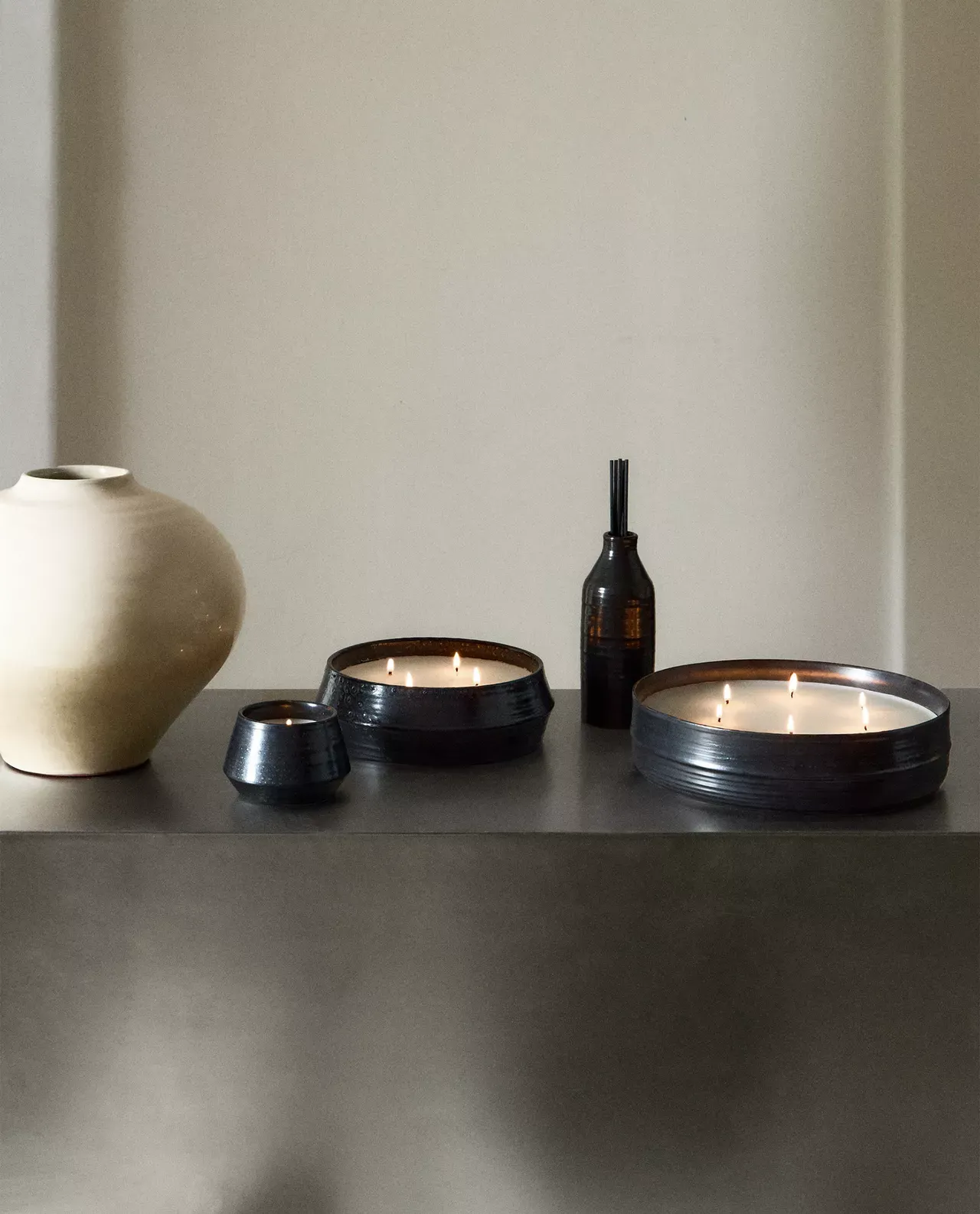 candles from Zara Home styled on a chrome tabletop