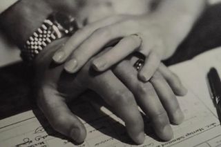 Hands of newly married couple