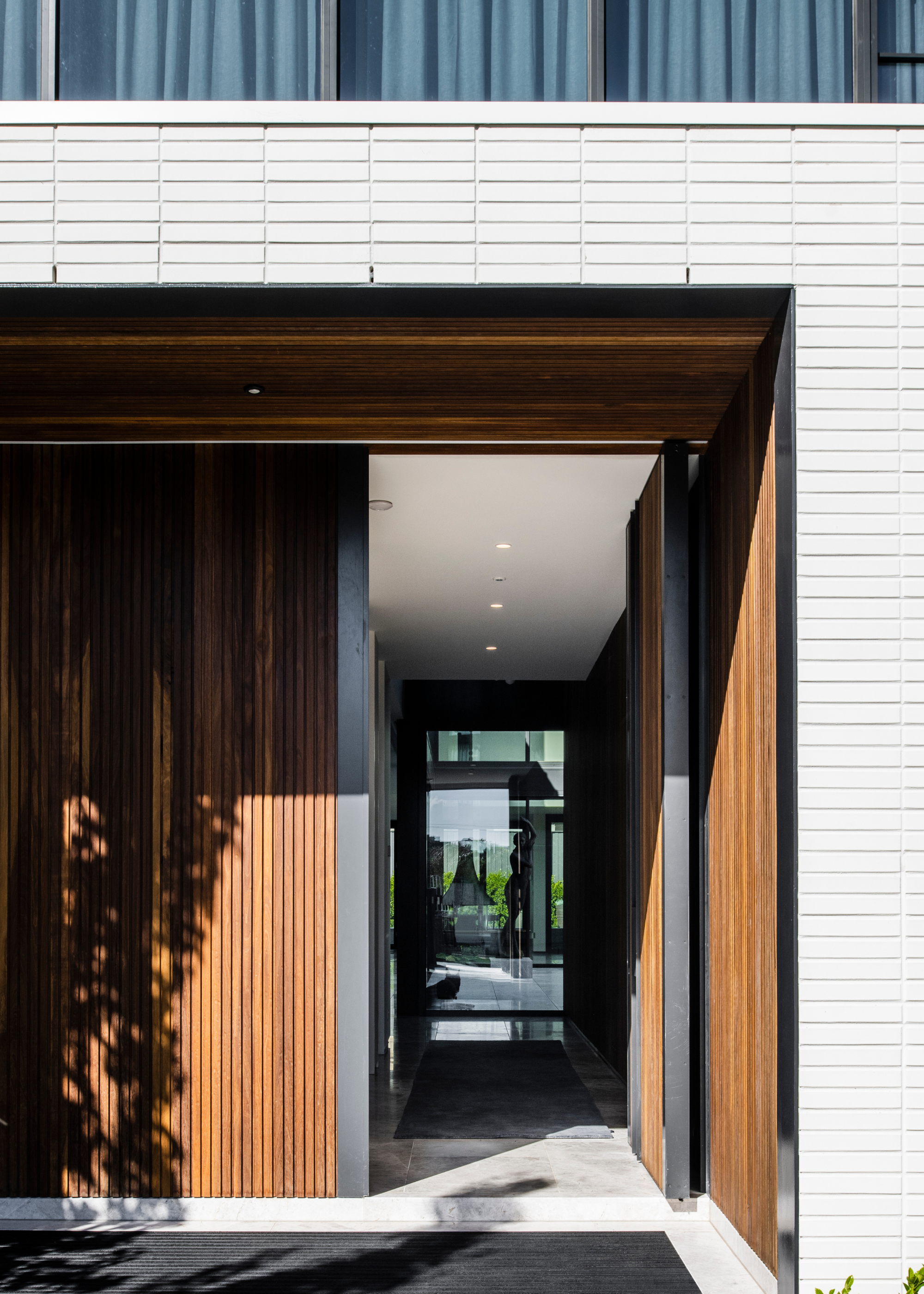 A wood entryway leading to a living room