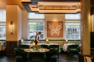 A waiter walks through the Grill 88 dining room