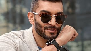Man speaking into Garmin Venu 2 Plus watch