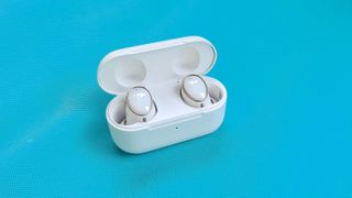 The 1More Evo wireless earbuds sitting in the charging case