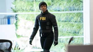 Katherine Renee Kane as Special Agent Tiffany Wallace in all black in FBI season 6