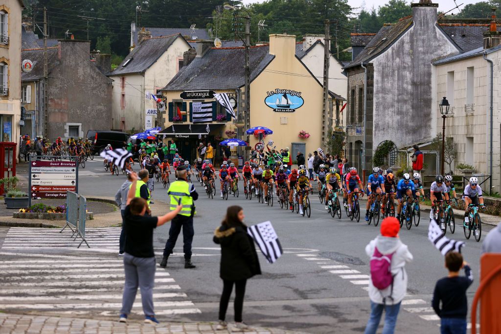 LANDERNEAU FRANCE JUNE 26 Georgia Williams of New Zealand Ane Santesteban Gonzalez of Spain Amanda Spratt of Australia Sarah Roy of Australia and Team BikeExchange The Peloton passing through Le Faou Village during the 8th La Course By Le Tour De France 2021 a 1077km race from Brest to Landerneau Cte De La Fosse Aux Loups 176m Fans Public LaCourse LeTour TDF2021 UCIWWT on June 26 2021 in Landerneau France Photo by Tim de WaeleGetty Images