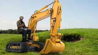 Sitting on a Roto VR Explorer chair wearing a Meta Quest 3 playing Dig VR. Grassy field generated by AI. Excavator provided by Adobe Stock.