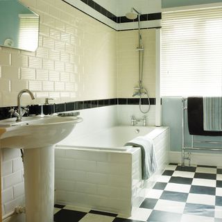 bathroom with metro wall tiles and basin with bathtub