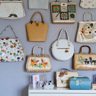 room with wall with handbags