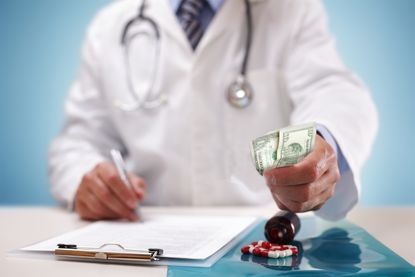 Doctor hands money over in Medicare case