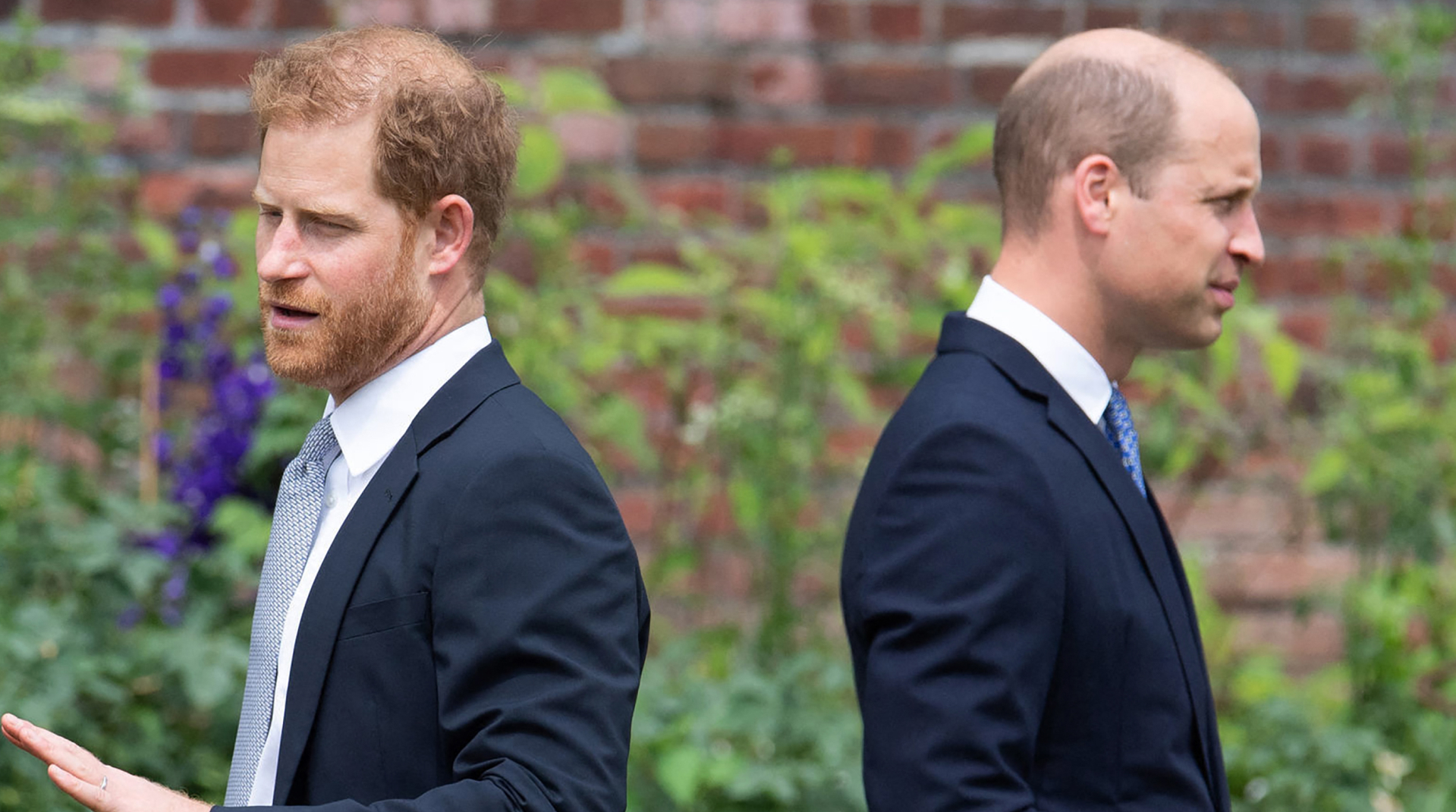 Britain's Prince Harry, Duke of Sussex (L) and Britain's Prince William, Duke of Cambridge attend the unveiling of a statue of their mother, Princess Diana at The Sunken Garden in Kensington Palace, London on July 1, 2021, which would have been her 60th birthday.