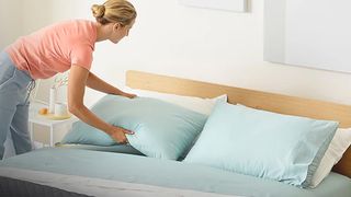 Casper Foam Pillow with Snow Technology pillow being arranged on bed