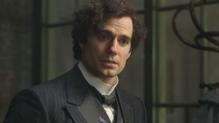 Henry Cavill looking off as Sherlock Holmes in Enola Holmes 2