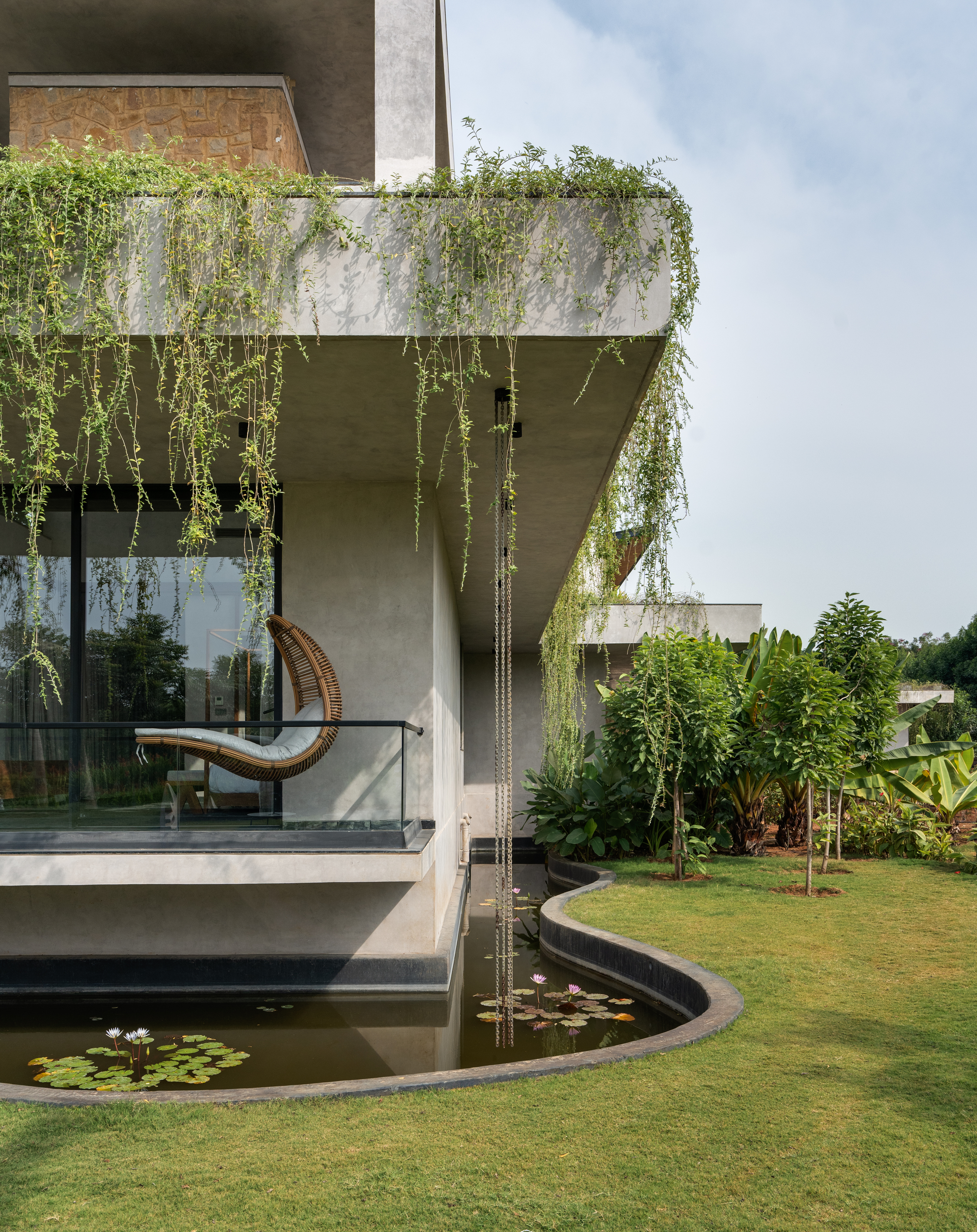 hyderabad home in brutalist style covered in greenery by 23 Degrees Design Shift