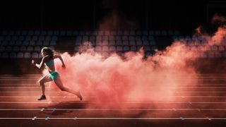 woman running on track with red smoke around her