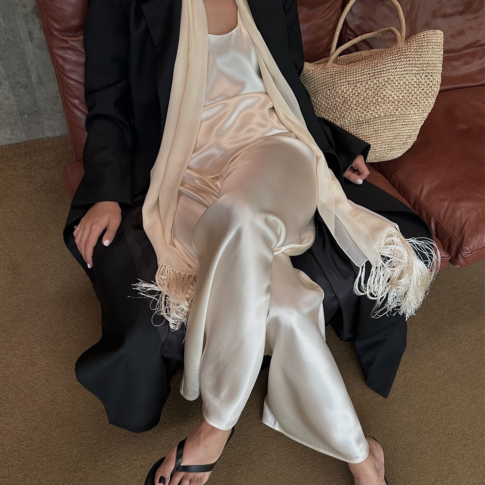 Woman in satin pants and top