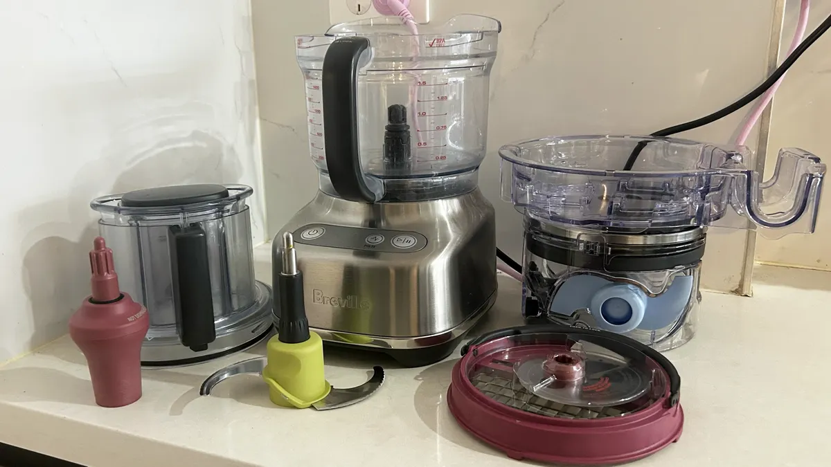Breville Paradice 9 with all of its attachments on white kitchen bench