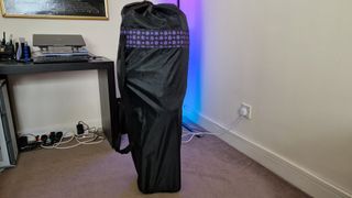 The Foldable Gaming Chair folded up and stored upright in the carrying bag