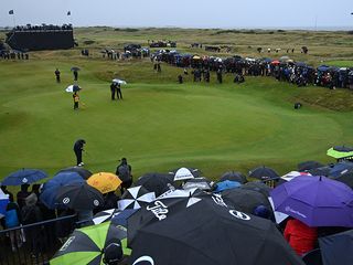 Shane Lowry putting in wet and windy conditions at the Open Championship