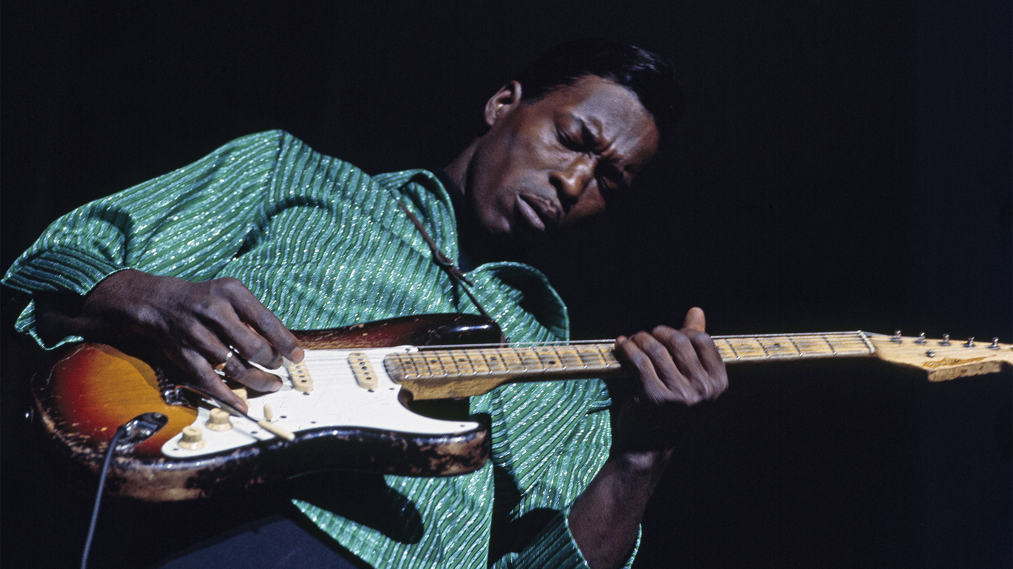 American blues guitarist and singer Buddy Guy performs live playing a Fender Stratocaster guitar on the American Folk Blues Festival tour in London in October 1965.