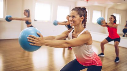 Cross training benefits: Image shows woman working out at fitness center