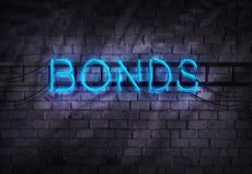 Bonds word in neon lights against brick wall