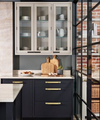 Black and white kitchen with with gold and black hardware